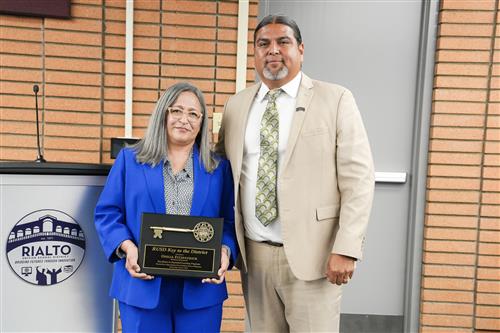 Ofeila Fitzpatrick Key to the District photo with Board Vice President Mr. Edgar Montes